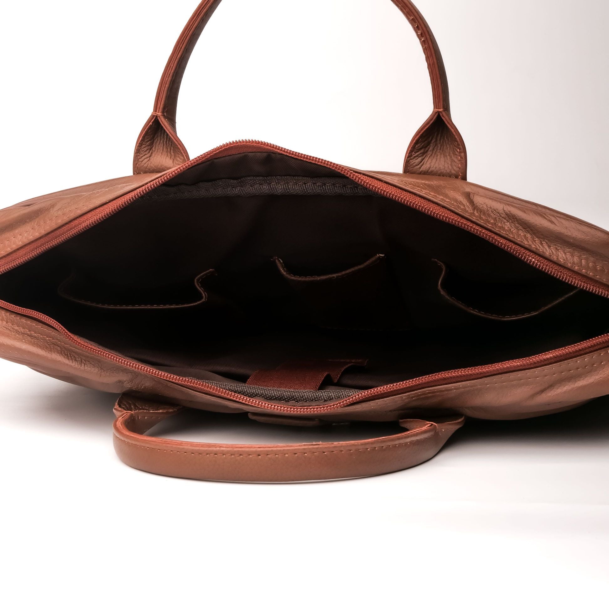 Executive Leather Laptop Bag in tan color, crafted from genuine cow leather, featuring adjustable shoulder strap and spacious compartments.
