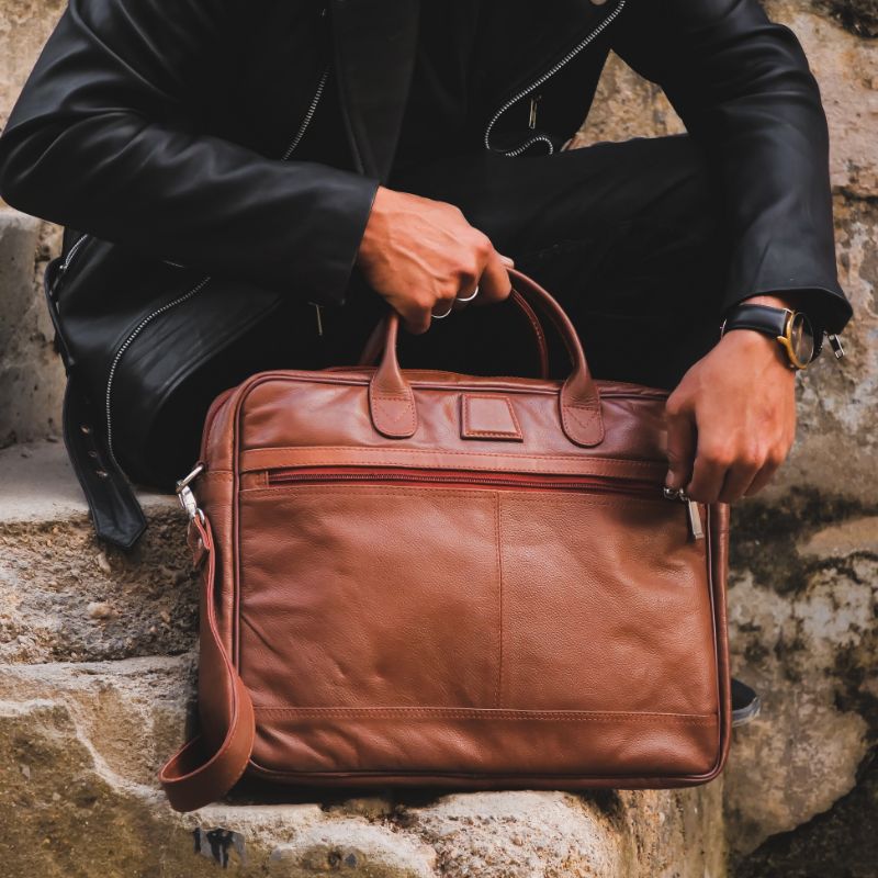 Executive Leather Laptop Bag in tan color, crafted from genuine cow leather, featuring adjustable shoulder strap and spacious compartments.