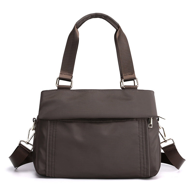 Fashion Portable Large-capacity Casual Oxford Messenger Bag in black, showcasing its spacious design and soft handle.