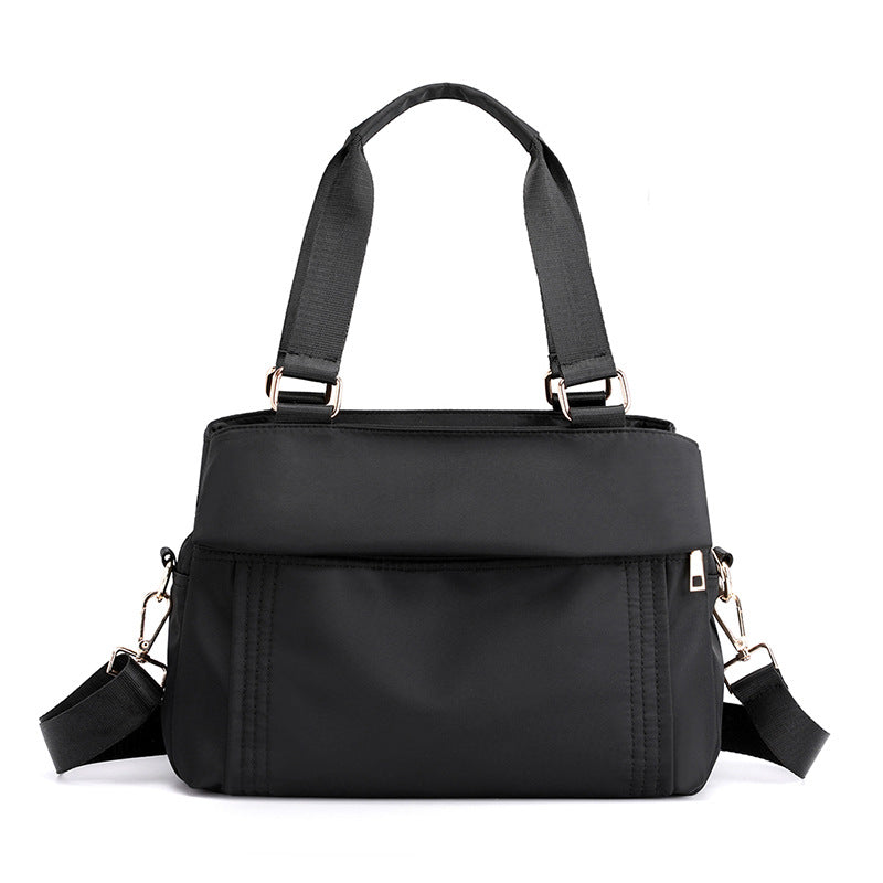 Fashion Portable Large-capacity Casual Oxford Messenger Bag in black, showcasing its spacious design and soft handle.