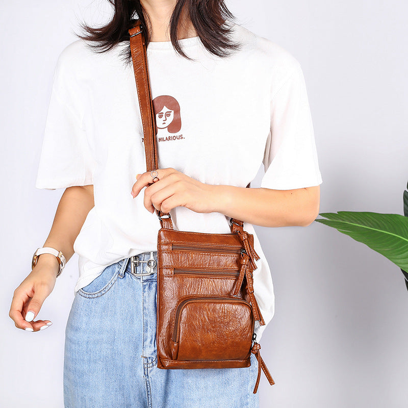 Fashion Retro Solid Color Shoulder Bag in a stylish square design, made of soft PU leather with multiple pockets for convenience.