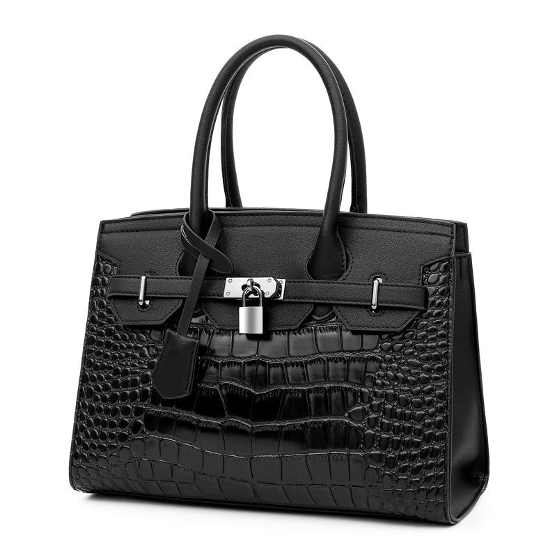 Fashion Women's PU Leather Handbag featuring a crocodile pattern, spacious design, and portable handle, perfect for casual occasions.