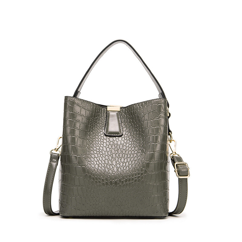 Fashionable Retro Bucket Style Handbag for Women in super oil leather with stone pattern, featuring multiple pockets and a stylish design.
