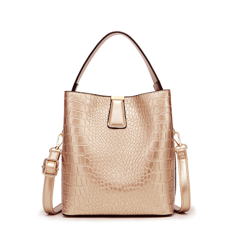 Fashionable Retro Bucket Style Handbag for Women in super oil leather with stone pattern, featuring multiple pockets and a stylish design.