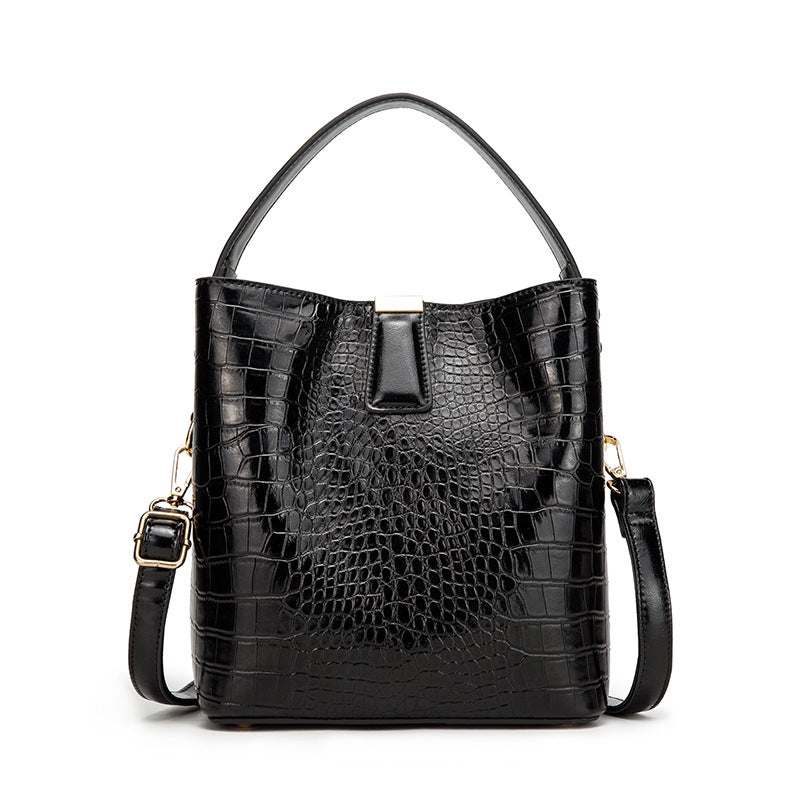 Fashionable Retro Bucket Style Handbag for Women in super oil leather with stone pattern, featuring multiple pockets and a stylish design.