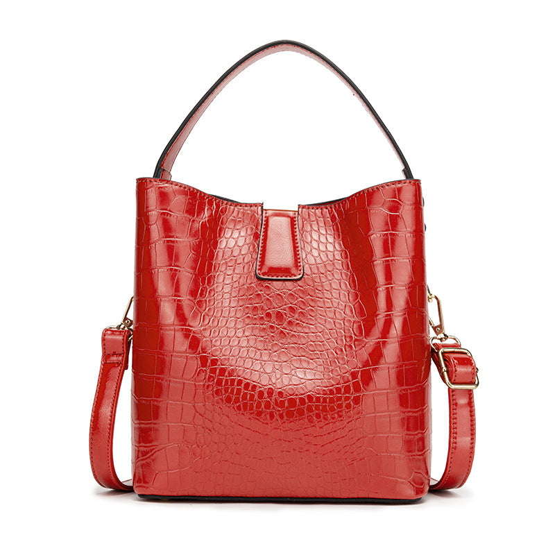 Fashionable Retro Bucket Style Handbag for Women in super oil leather with stone pattern, featuring multiple pockets and a stylish design.