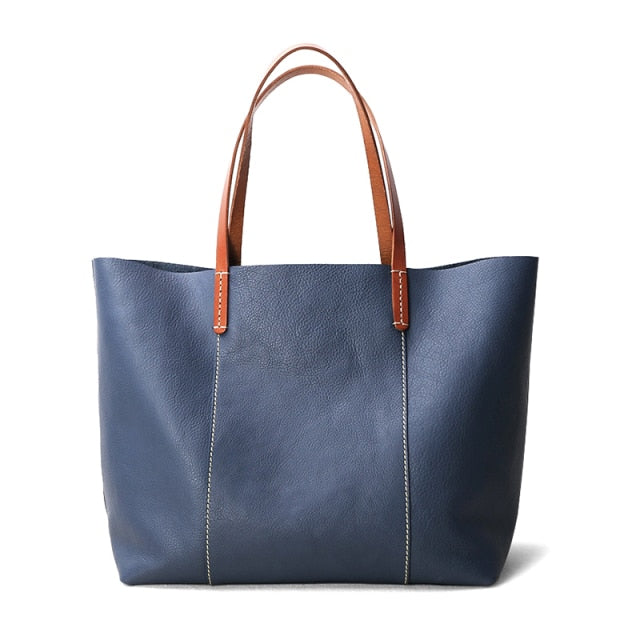 Genuine Leather Simple Tote in blue and green, showcasing its soft structure and zipper closure.