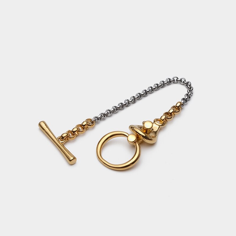 Gold and silver trendy metal bracelet with geometric design, perfect for women.