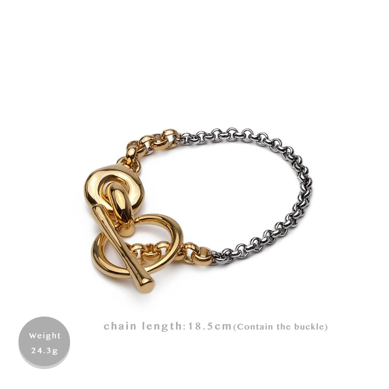 Gold and silver trendy metal bracelet with geometric design, perfect for women.