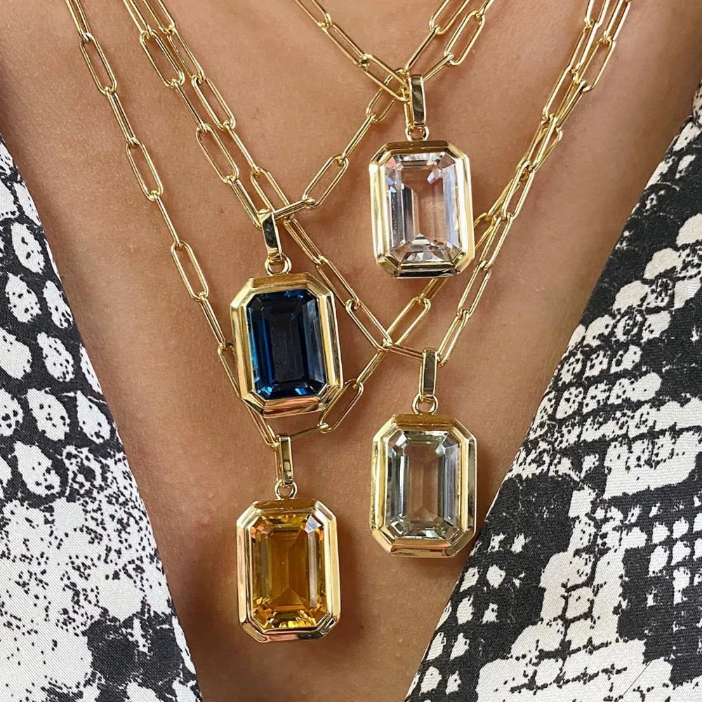 A stunning geometric square crystal pendant necklace made of stainless steel, featuring a stylish link chain, perfect for women.