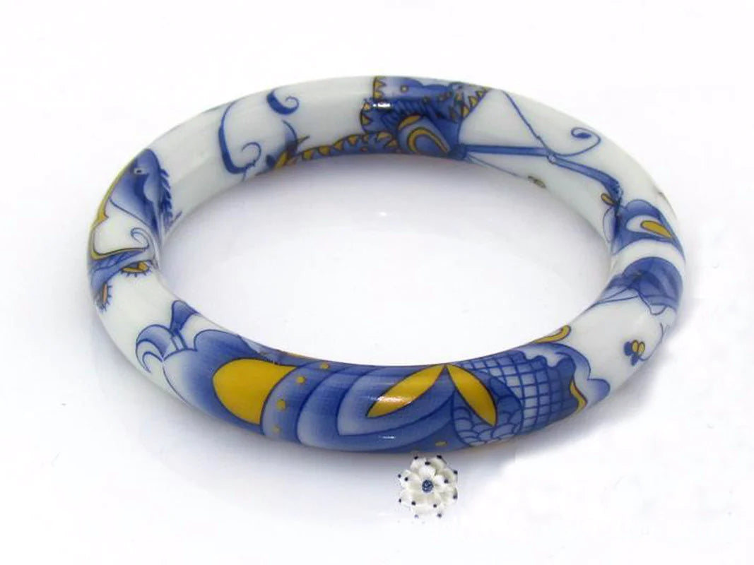 Gorgeous round blue and white porcelain bracelet showcasing a classic geometric design, perfect for women's fashion.