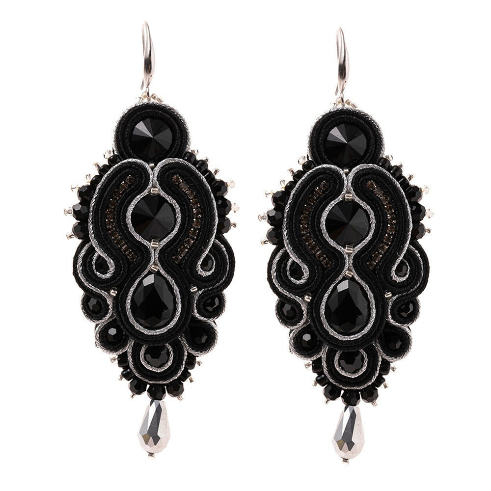 A pair of handmade soutache earrings featuring vibrant colors and geometric designs, perfect for women and special occasions.