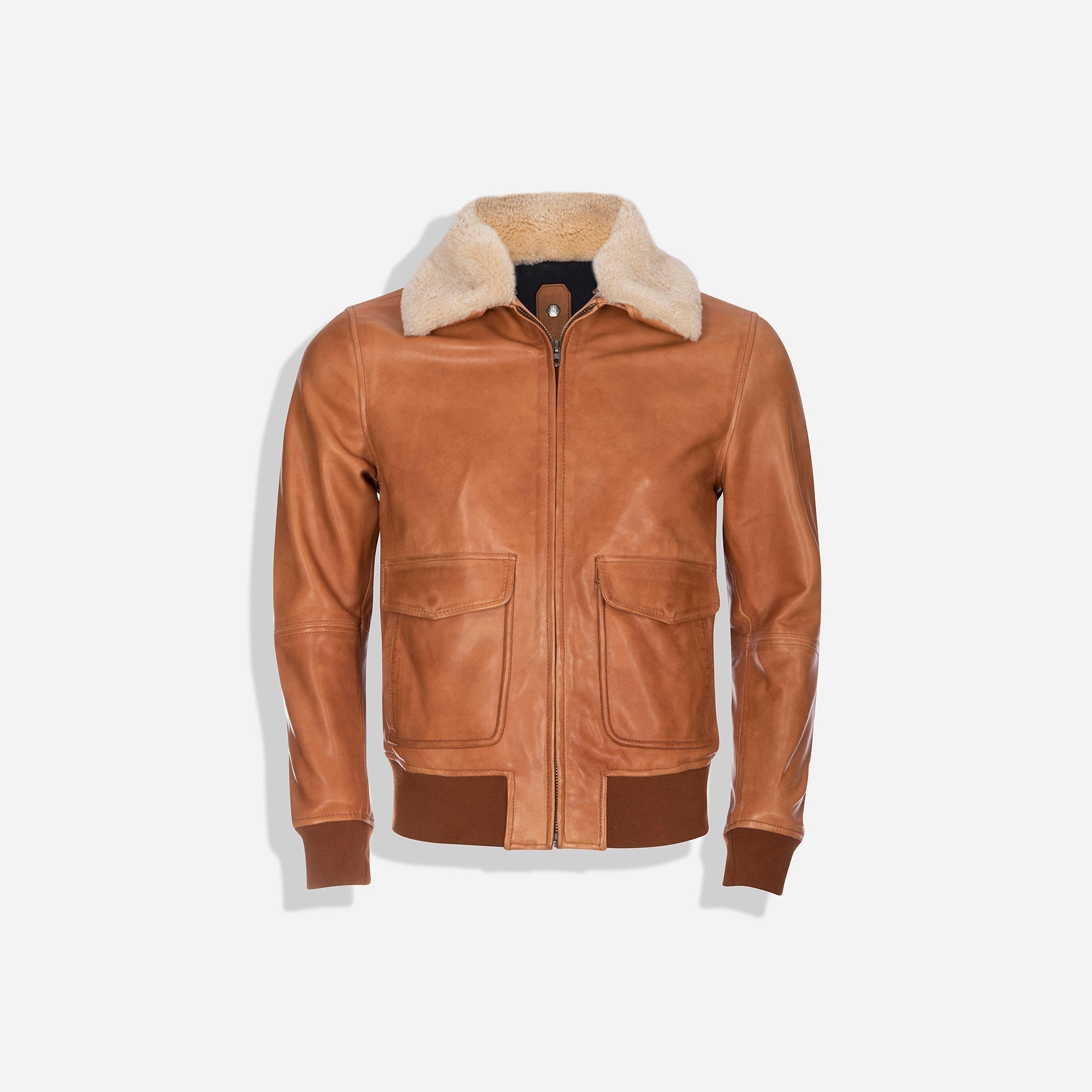 Tan Harry Bomber Jacket with detachable fur collar and iconic inner lining, showcasing stylish design and comfort.