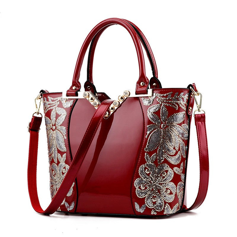 High Quality Embroidered PU Leather Handbag for Women featuring a bucket shape, elegant embroidery, and three adjustable shoulder straps.