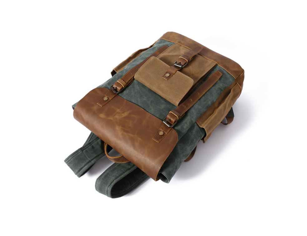 High Quality Fashion Canvas Backpack in vintage style, featuring multiple pockets and comfortable straps, suitable for men and women.