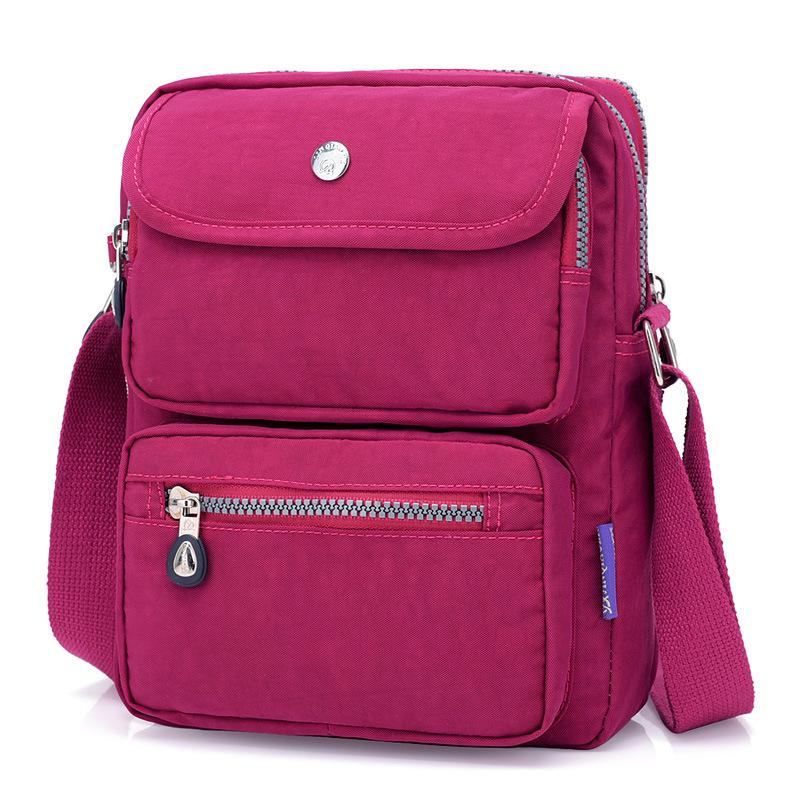 High Quality One Shoulder Slung Ladies Messenger Bag in vibrant candy colors, showcasing its stylish design and durable nylon fabric.