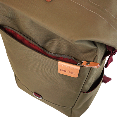 Highline Daypack in various colors with leather accents, showcasing its sleek design and multiple pockets.