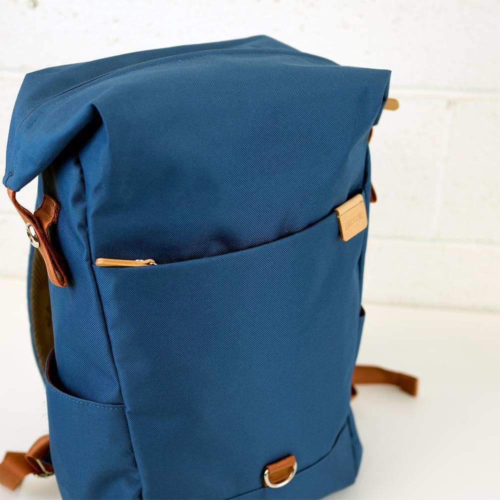 Highline Daypack in various colors with leather accents, showcasing its sleek design and multiple pockets.
