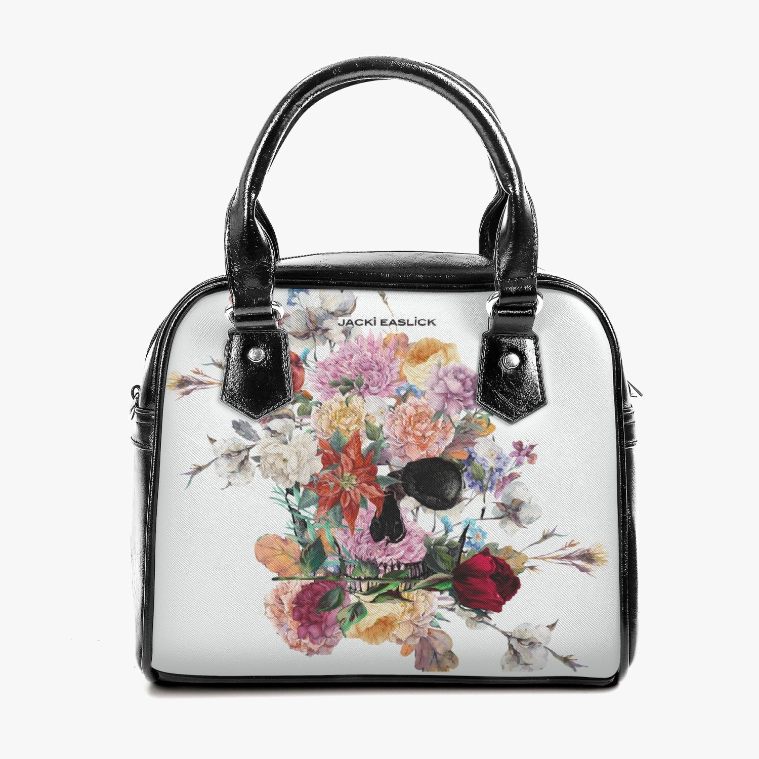 Jacki Easlick Floral Skull Leather Saddle Bag featuring a unique floral skull design, adjustable strap, and spacious interior.