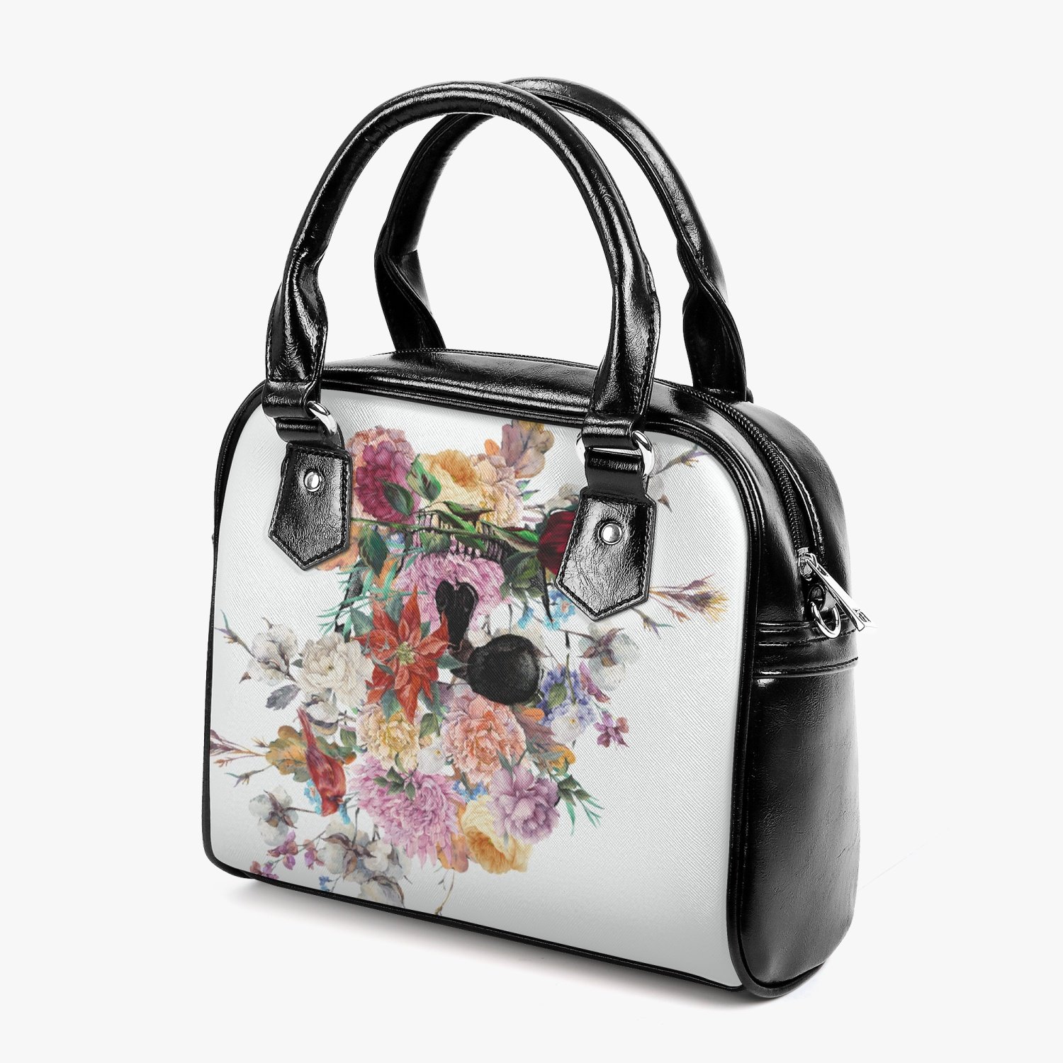 Jacki Easlick Floral Skull Leather Saddle Bag featuring a unique floral skull design, adjustable strap, and spacious interior.