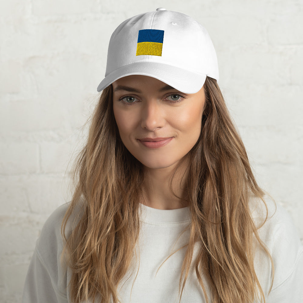 Jacki Easlick Support Ukraine Hat featuring green camo design, embroidered details, and adjustable strap.