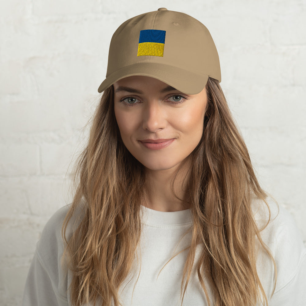 Jacki Easlick Support Ukraine Hat featuring green camo design, embroidered details, and adjustable strap.