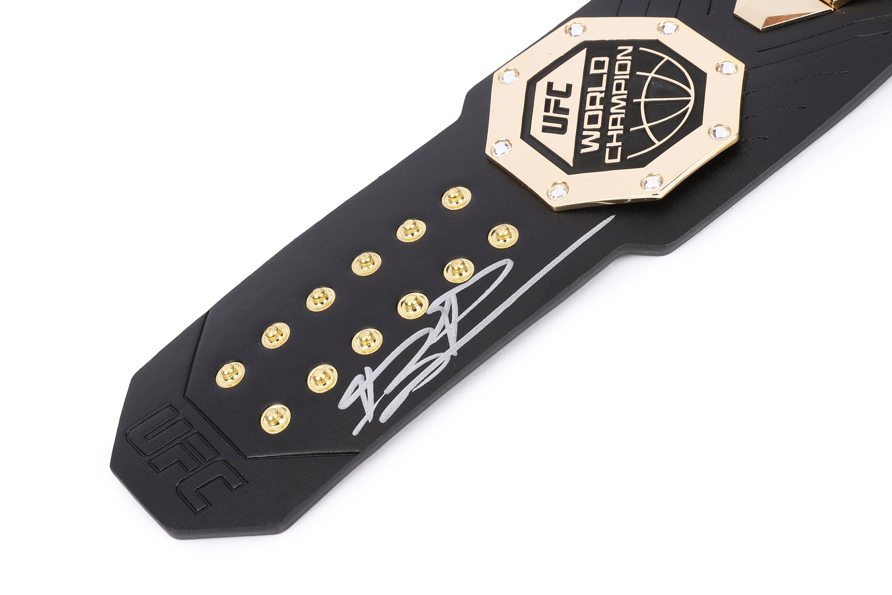Jiří Procházka signed UFC legacy replica desktop belt displayed on a desk, showcasing its intricate design and signature.