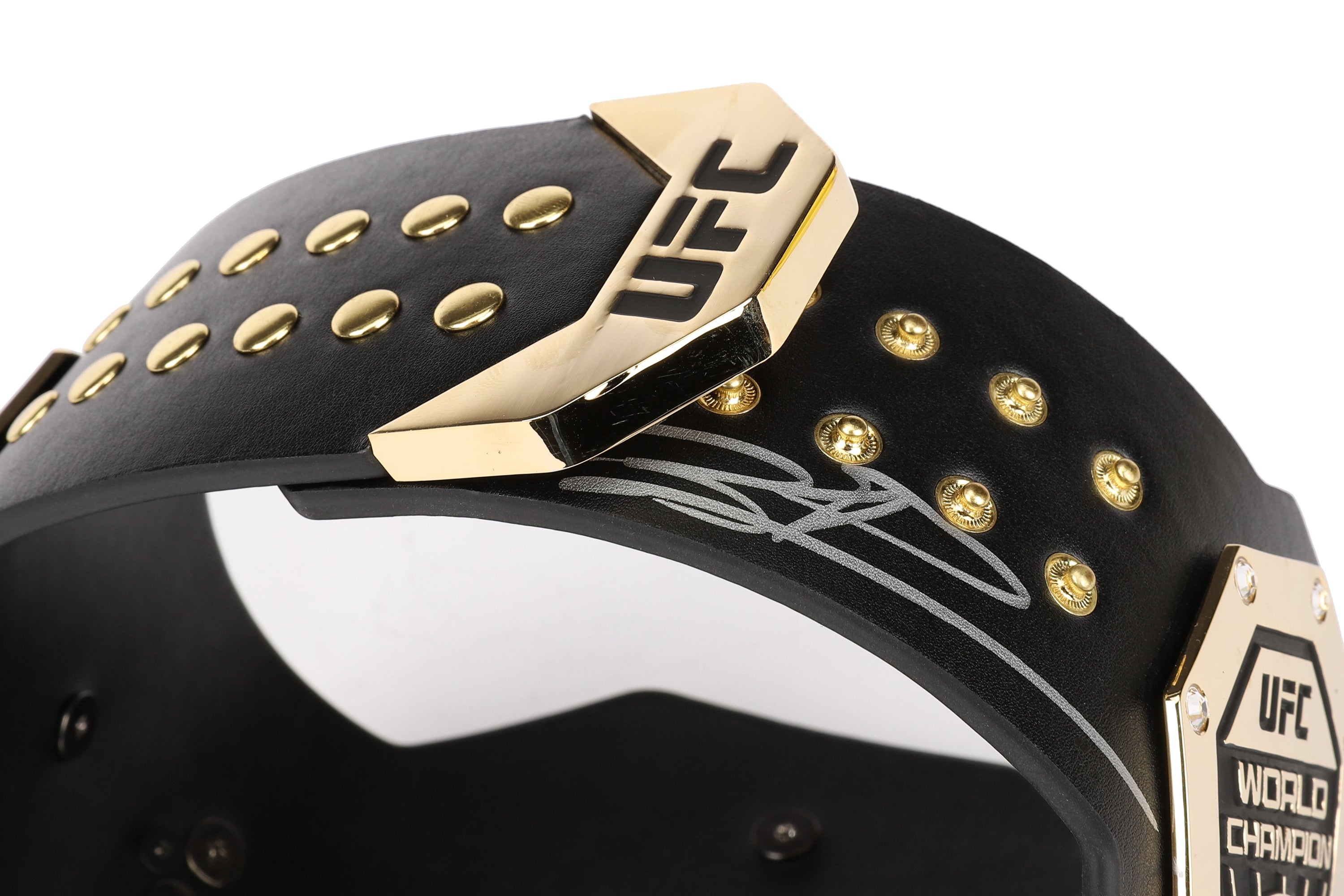 Jiří Procházka signed UFC legacy replica desktop belt displayed on a desk, showcasing its intricate design and signature.