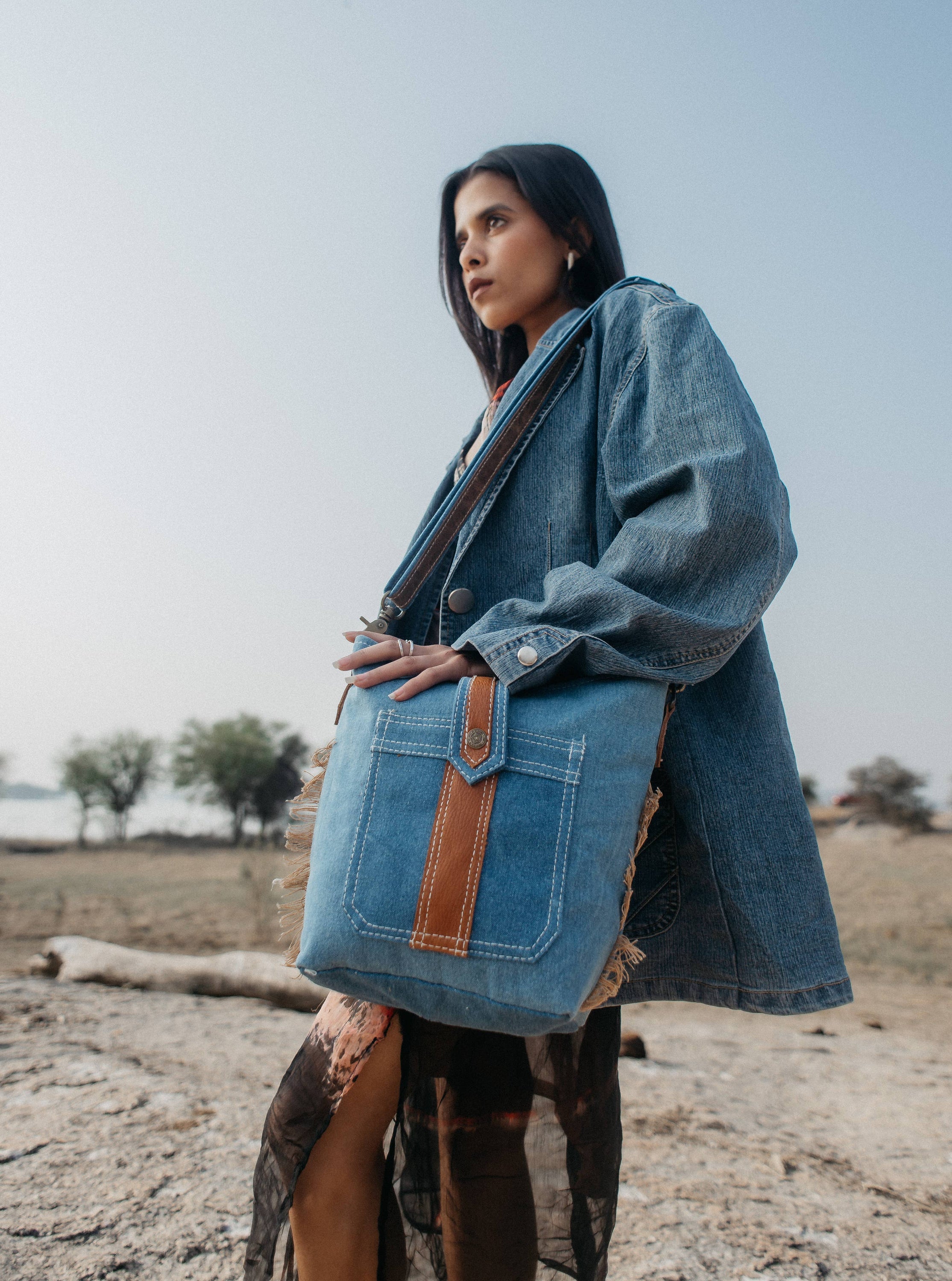 Jiok Crossbody Bag made of denim fabric and leather, featuring a stylish design and smooth YKK zipper closure.