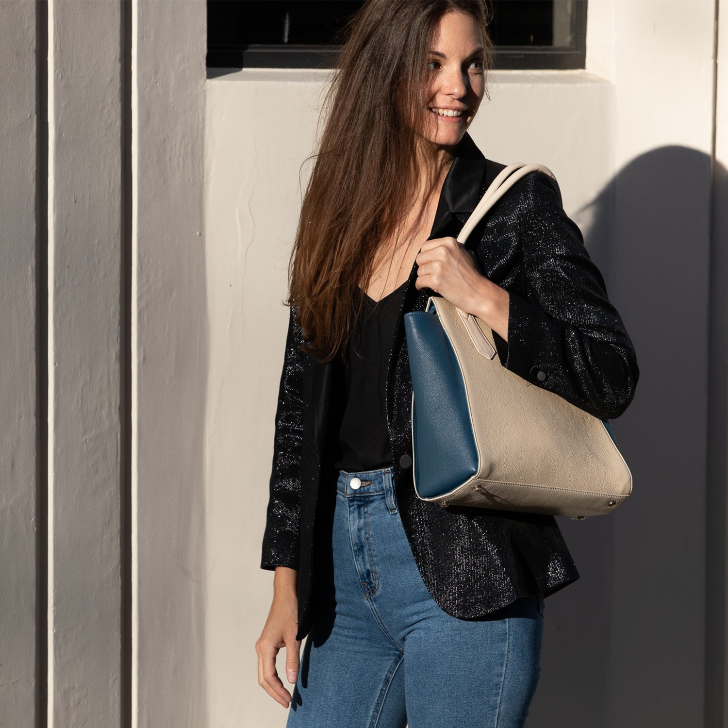 Jody Off White Tote Bag made of genuine pebble leather with gold hardware, featuring a spacious interior and double handles.