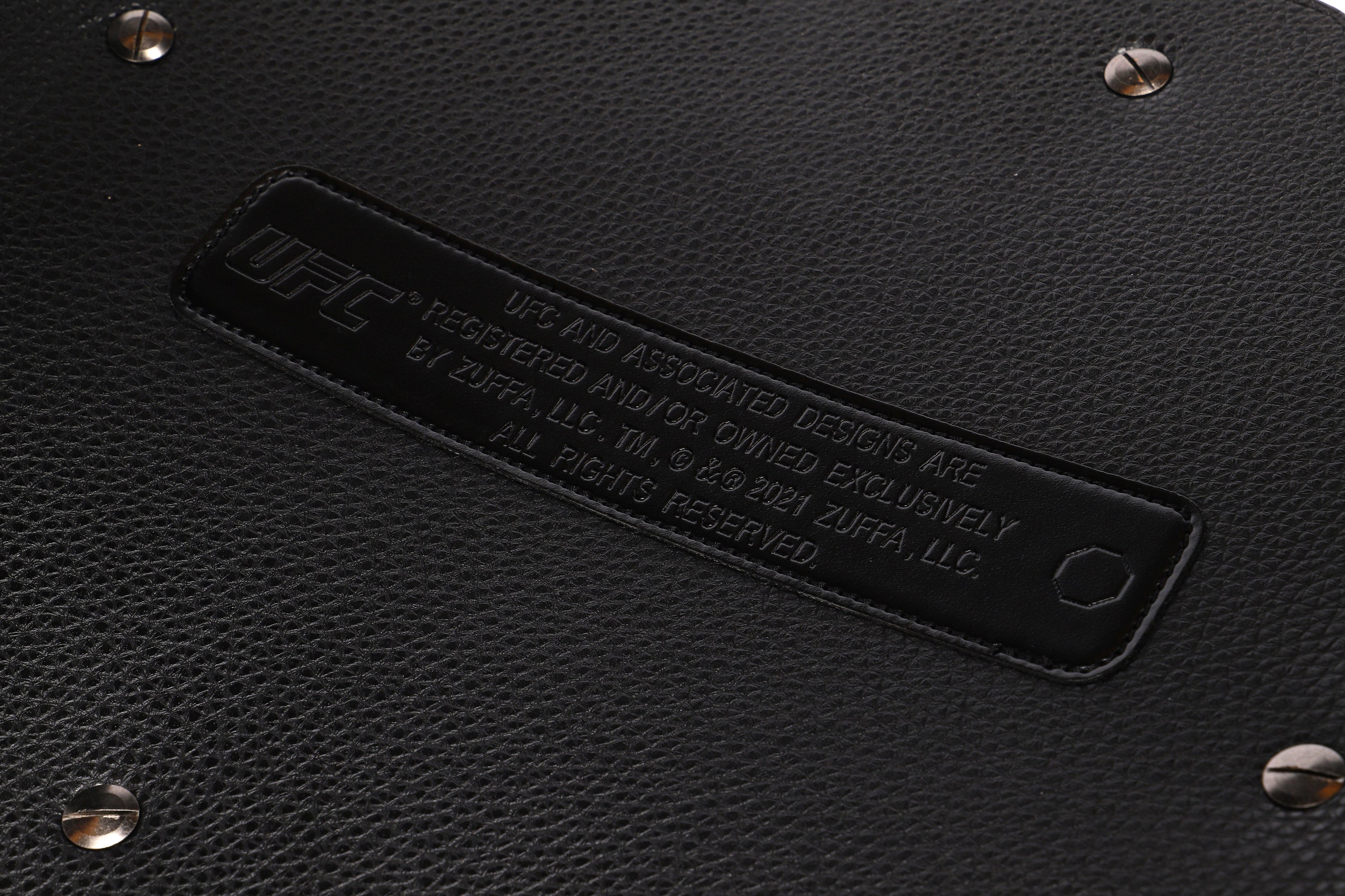 Jon Jones signed UFC classic championship replica belt, showcasing intricate details and authentic autograph.