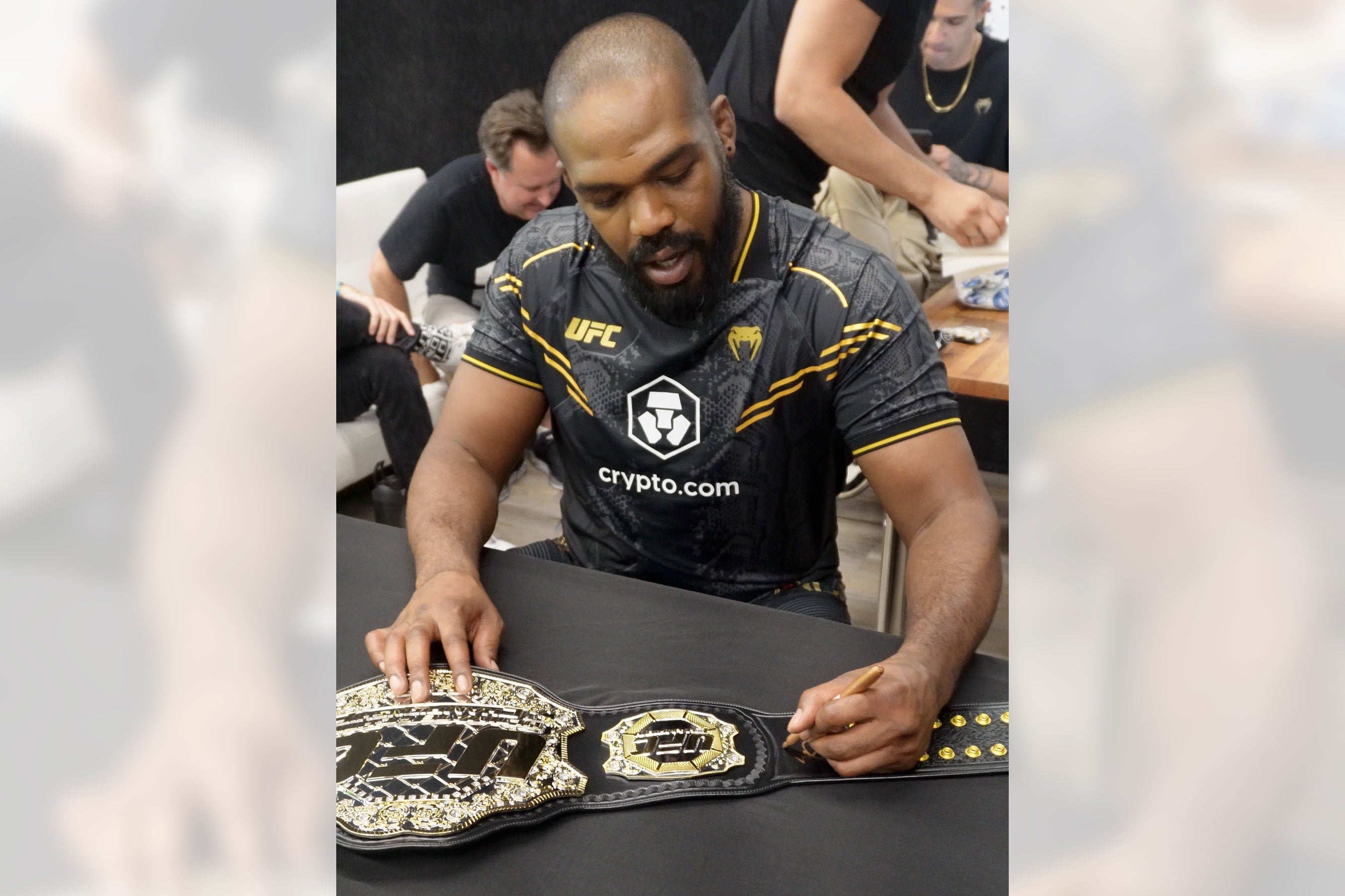 Jon Jones signed UFC classic championship replica belt, showcasing intricate details and authentic autograph.