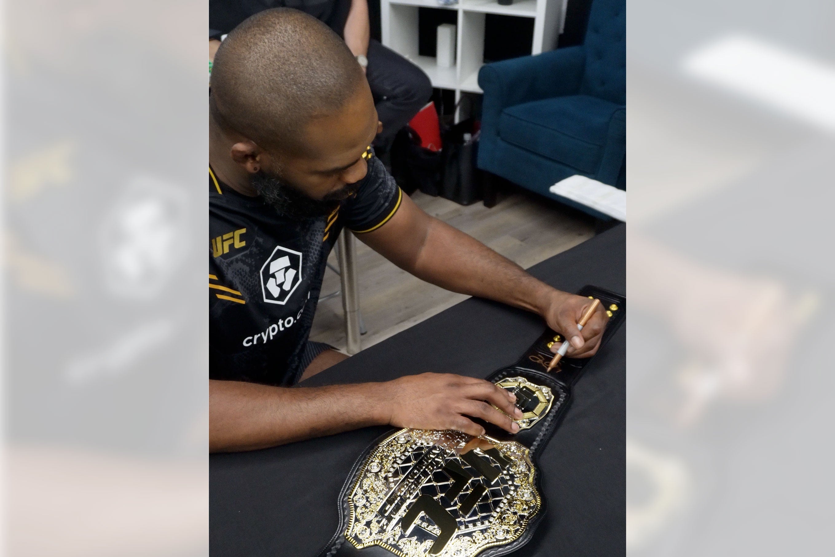 Jon Jones signed UFC classic championship replica belt, showcasing intricate details and authentic autograph.