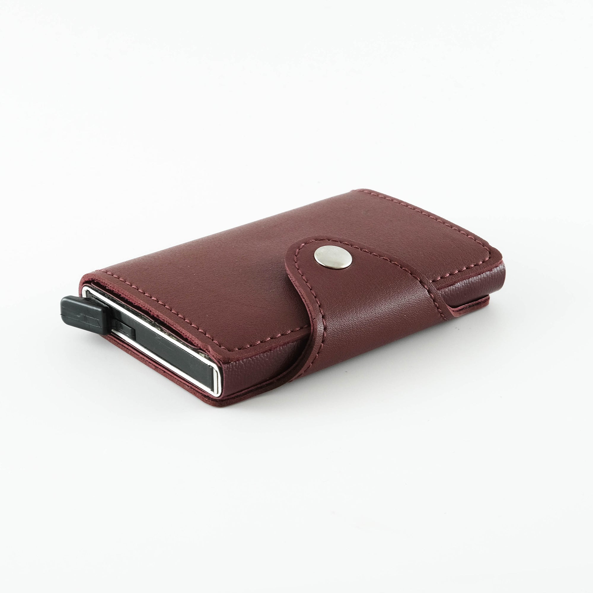 Konk Synthetic Leather RFID Protection Pop-up Cardholder in red, showcasing its sleek design and pop-up mechanism.