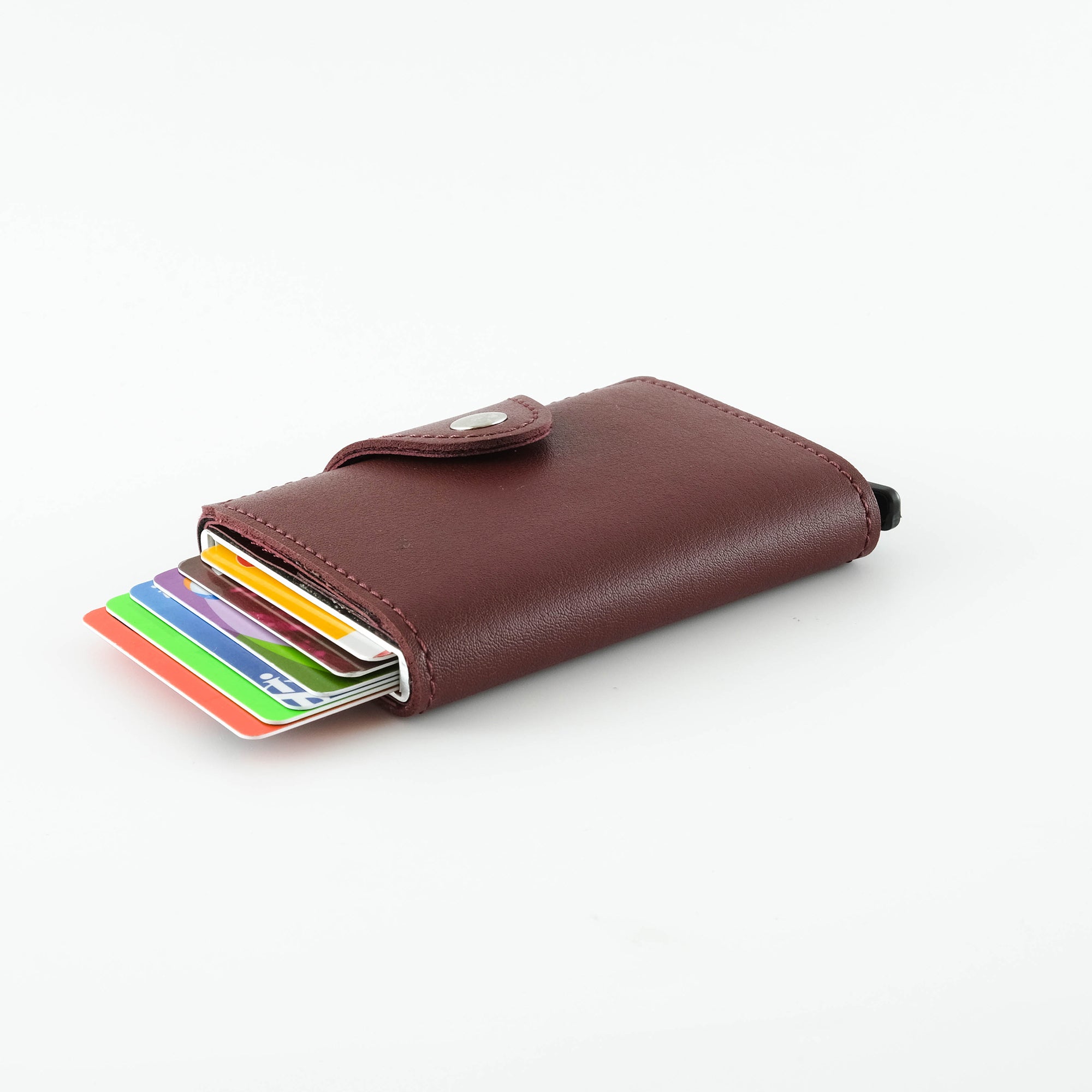 Konk Synthetic Leather RFID Protection Pop-up Cardholder in red, showcasing its sleek design and pop-up mechanism.