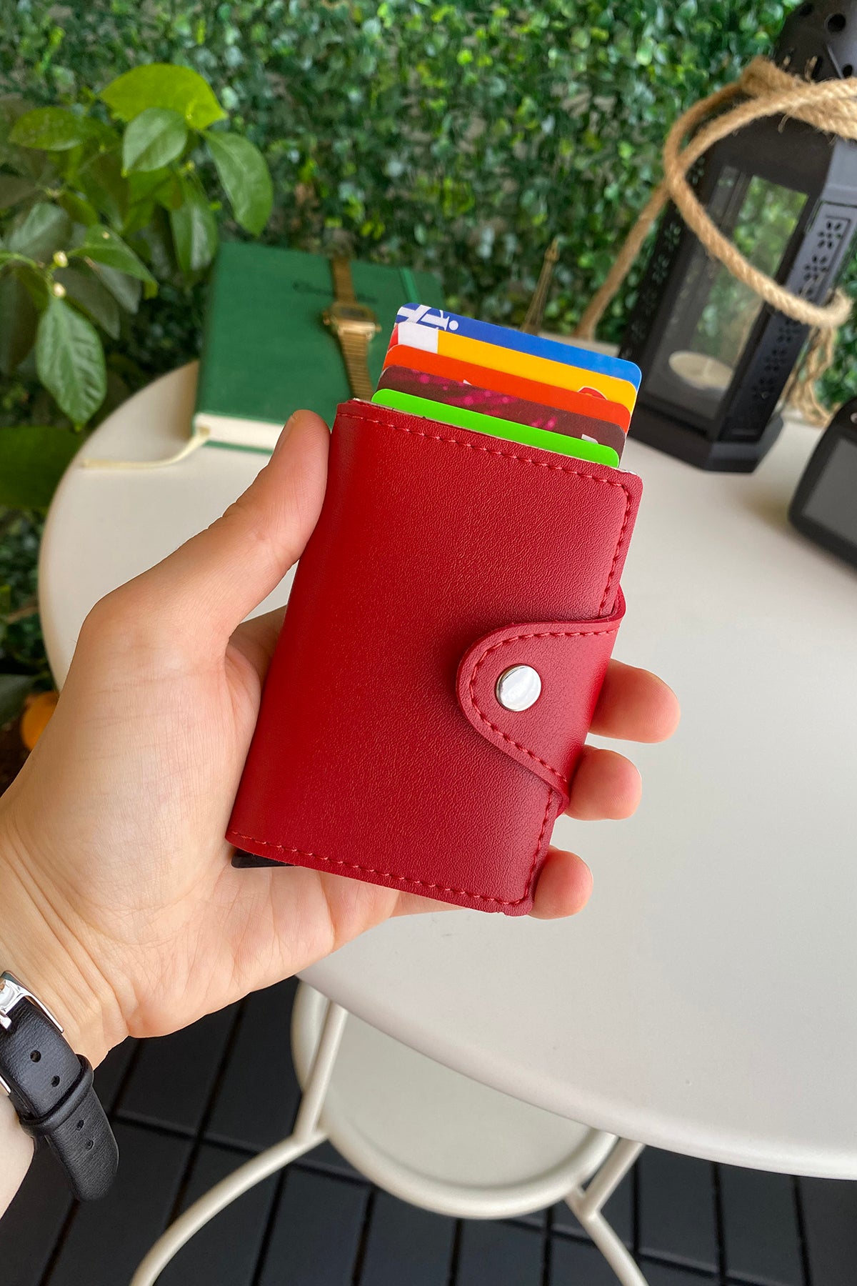 Konk Synthetic Leather RFID Protection Pop-up Cardholder in red, showcasing its sleek design and pop-up mechanism.