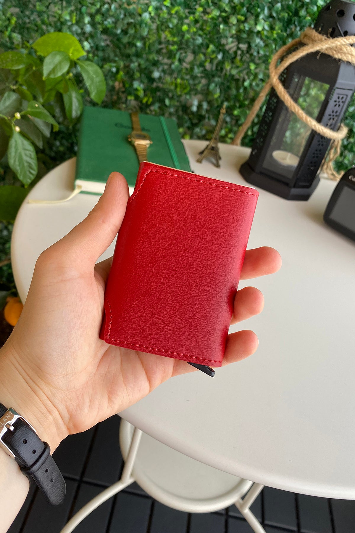 Konk Synthetic Leather RFID Protection Pop-up Cardholder in red, showcasing its sleek design and pop-up mechanism.
