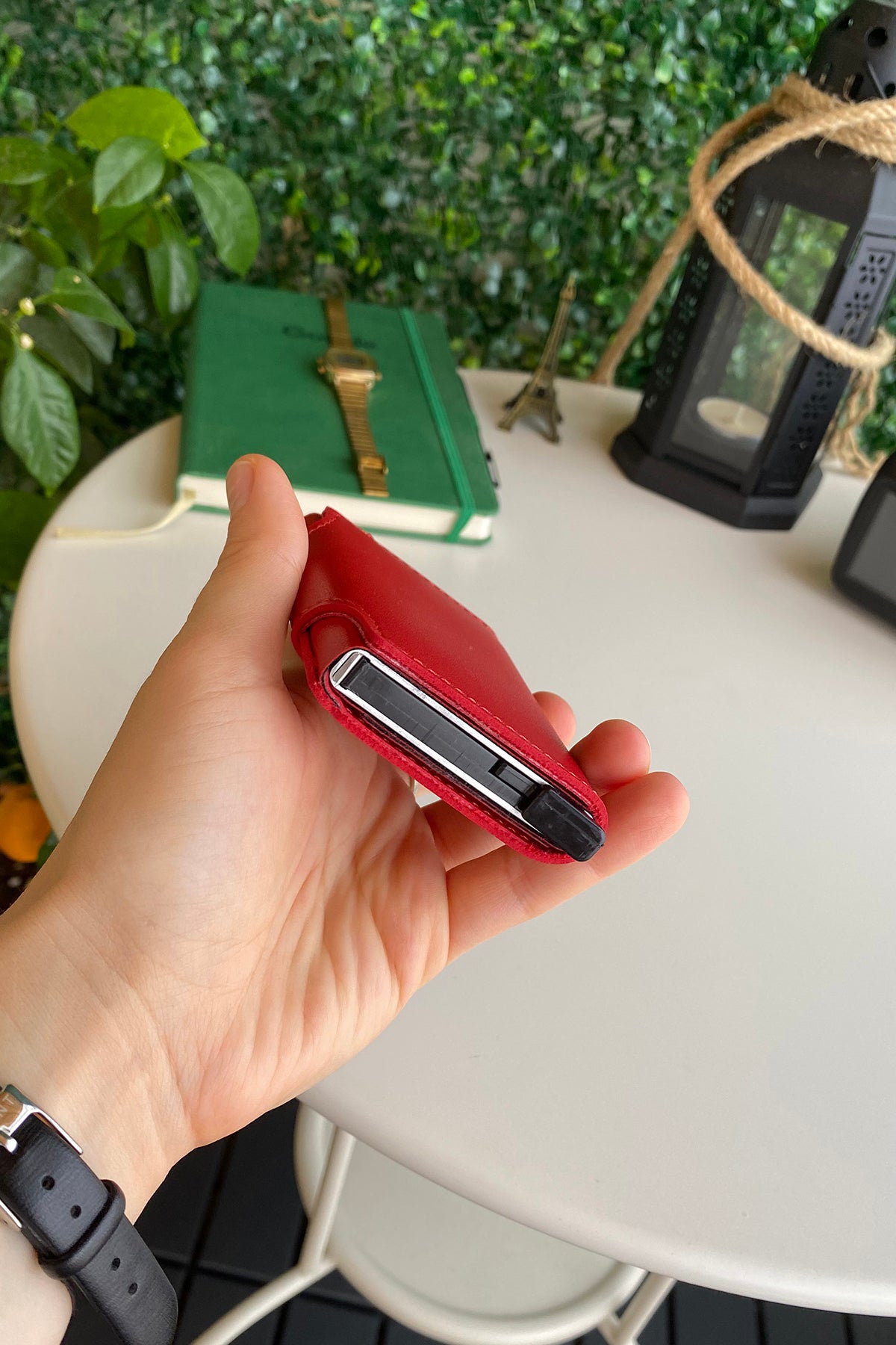 Konk Synthetic Leather RFID Protection Pop-up Cardholder in red, showcasing its sleek design and pop-up mechanism.