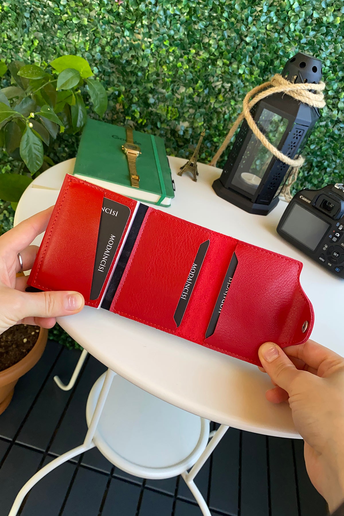 Konk Synthetic Leather RFID Protection Pop-up Cardholder in red, showcasing its sleek design and pop-up mechanism.
