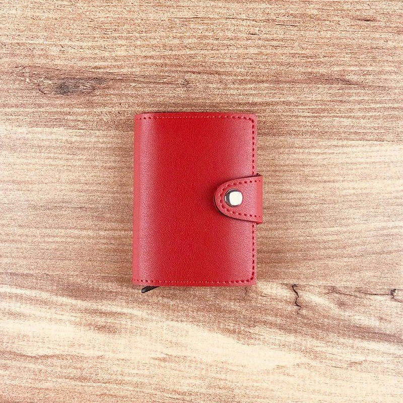 Konk Synthetic Leather RFID Protection Pop-up Cardholder in red, showcasing its sleek design and pop-up mechanism.