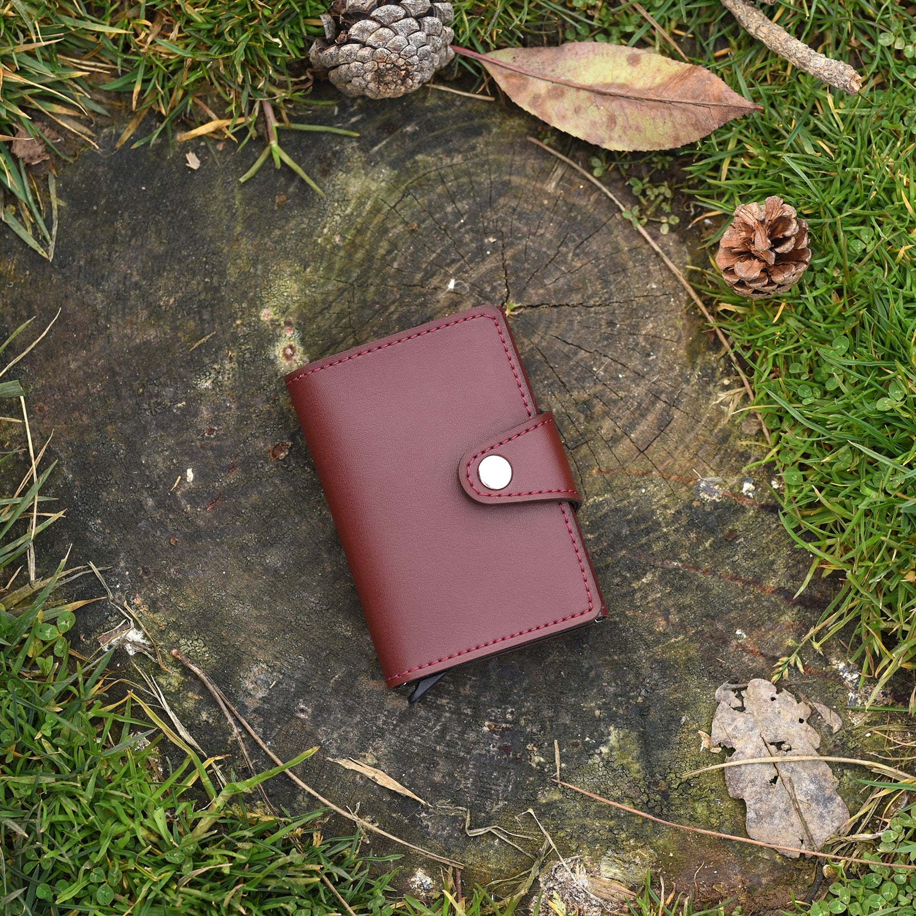 Konk Synthetic Leather RFID Protection Pop-up Cardholder in red, showcasing its sleek design and pop-up mechanism.