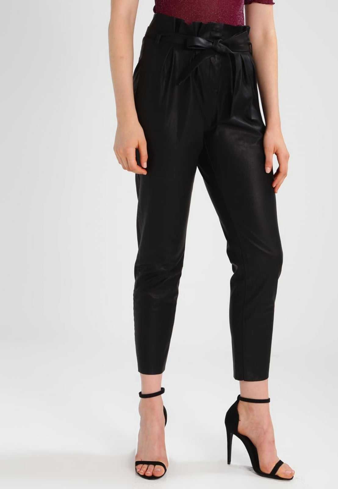 Koza Leathers Women's Real Lambskin Leather Capri Pant WP053 displayed on a mannequin, showcasing its sleek design and high-quality lambskin leather.