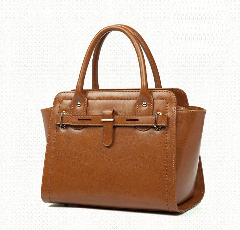 Elegant ladies quality fashion handbag made from two-layer cowhide leather, featuring a soft handle and leather lining, perfect for daily occasions.