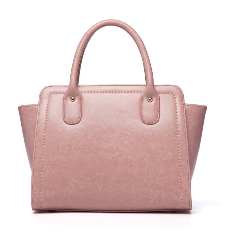 Elegant ladies quality fashion handbag made from two-layer cowhide leather, featuring a soft handle and leather lining, perfect for daily occasions.