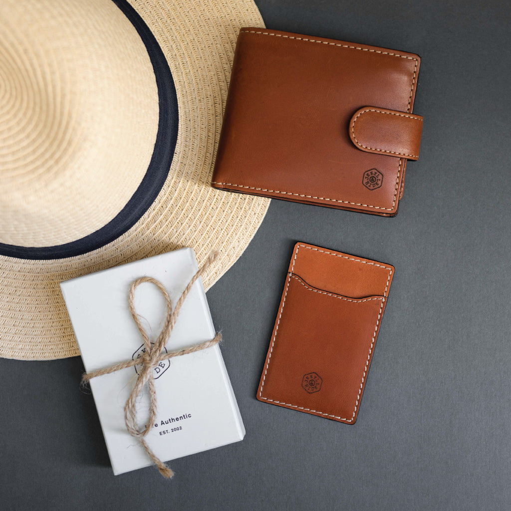 Large bifold wallet in clay color with a coin pouch, showcasing double-edged stitching and spacious design.