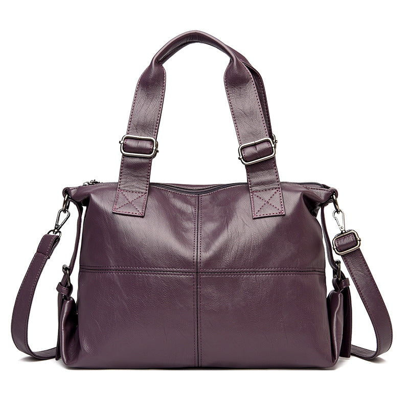 Large Capacity Female Casual Boston Style Bag made of leather, featuring a spacious interior and stylish design, perfect for everyday use.
