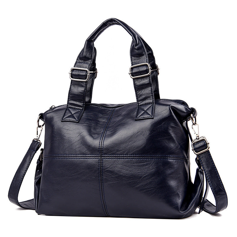 Large Capacity Female Casual Boston Style Bag made of leather, featuring a spacious interior and stylish design, perfect for everyday use.