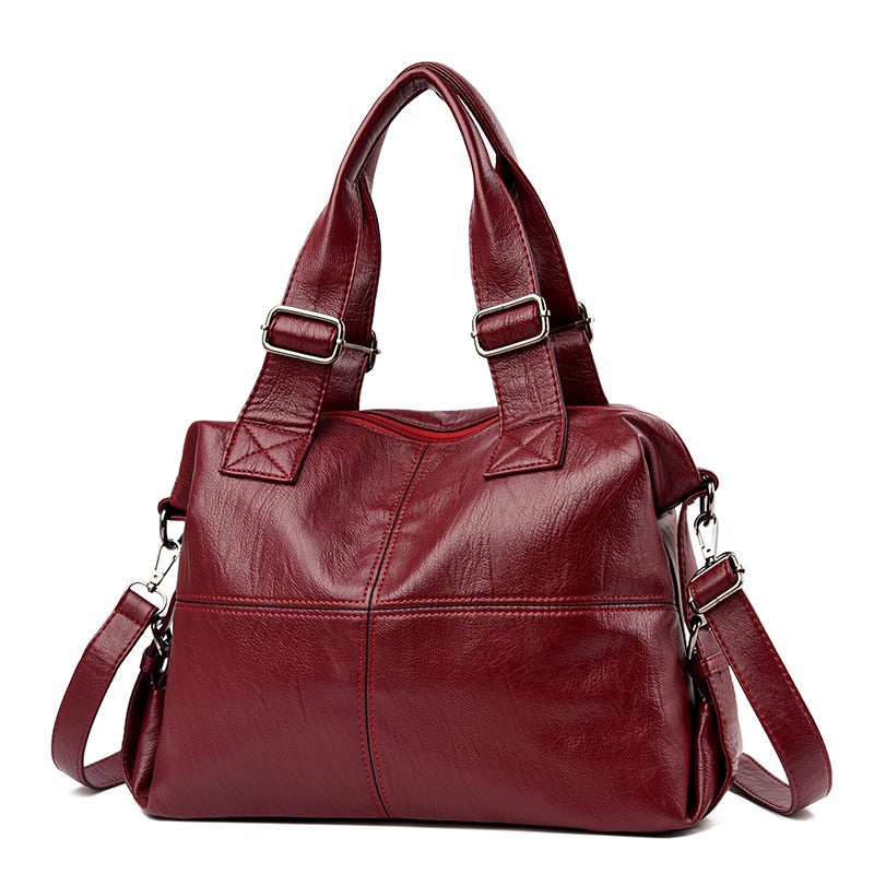 Large Capacity Female Casual Boston Style Bag made of leather, featuring a spacious interior and stylish design, perfect for everyday use.