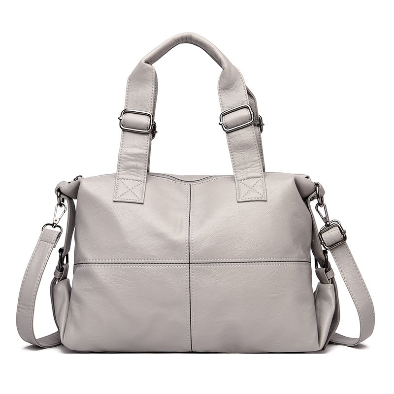 Large Capacity Female Casual Boston Style Bag made of leather, featuring a spacious interior and stylish design, perfect for everyday use.