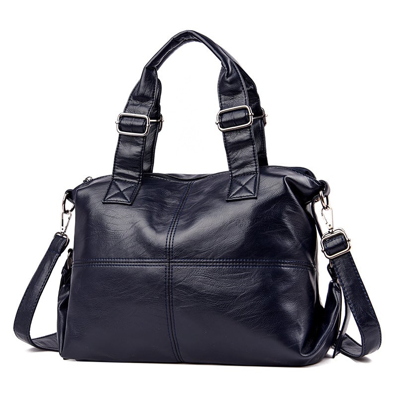 Large Capacity Female Casual Boston Style Bag made of leather, featuring a spacious interior and stylish design, perfect for everyday use.